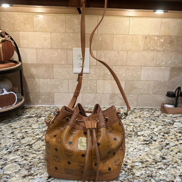 MCM Handbags - MCM Visetos Cognac Nappa Leather Monogram Drawstring Bucket Bag. Authentic!